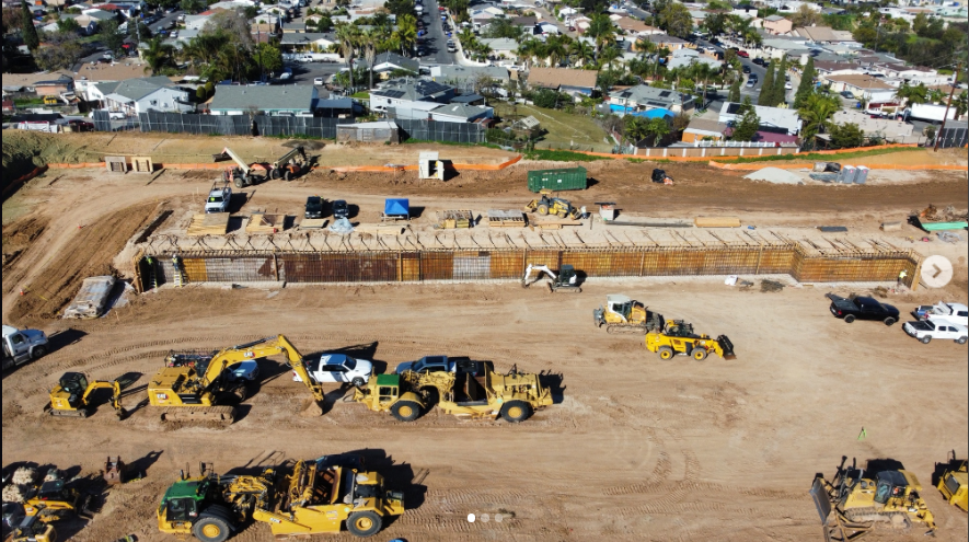 Image shows earthworks and the construction of the first retaining wall